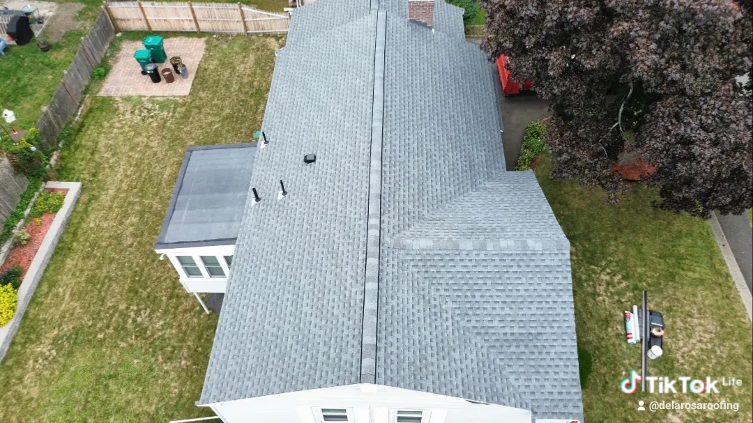 Aerial view of completed gray shingle roof